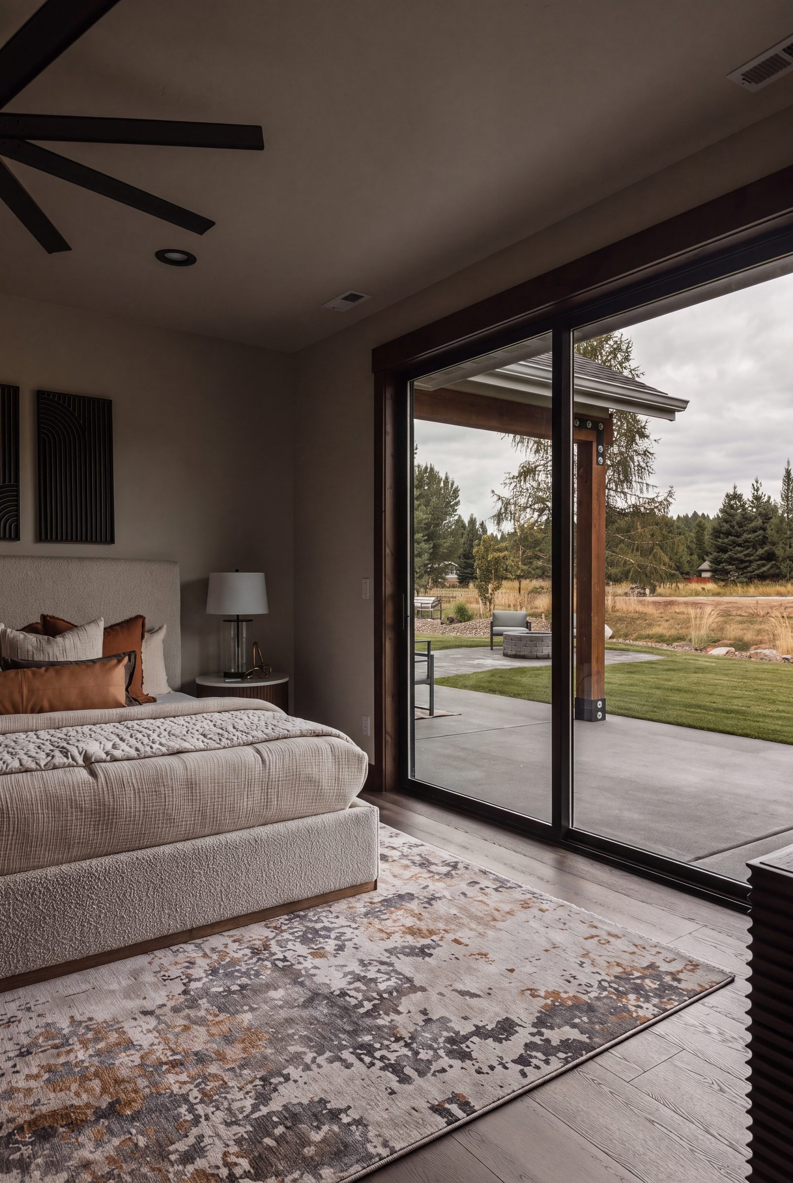 The primary suite looking out to the evergreens